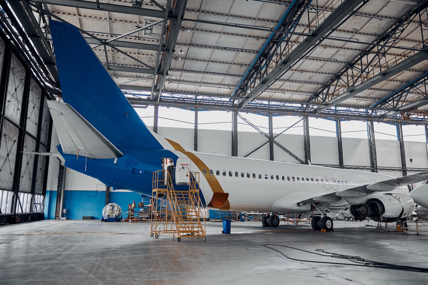 Professional plane expluatation service in big hangar